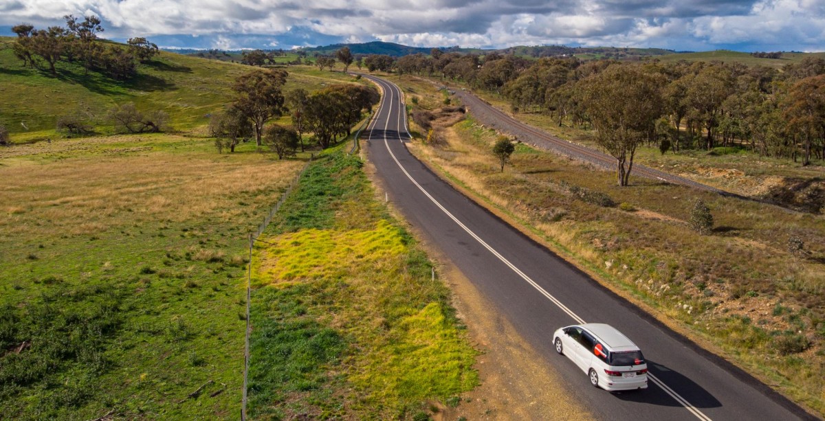 Spaceships campervan on the road in NSW - photo taken from above on a sunny day