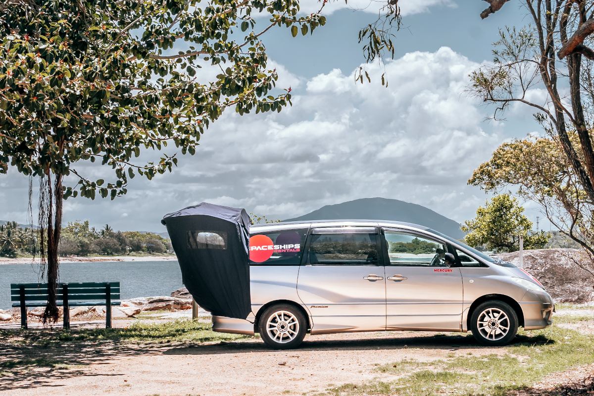 Side-view of campervan with rear awning set up