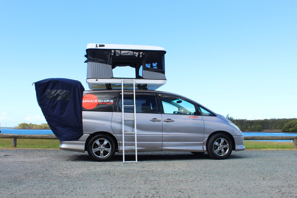 Spaceships 4-berth family campervan parked with the rooftop tent open