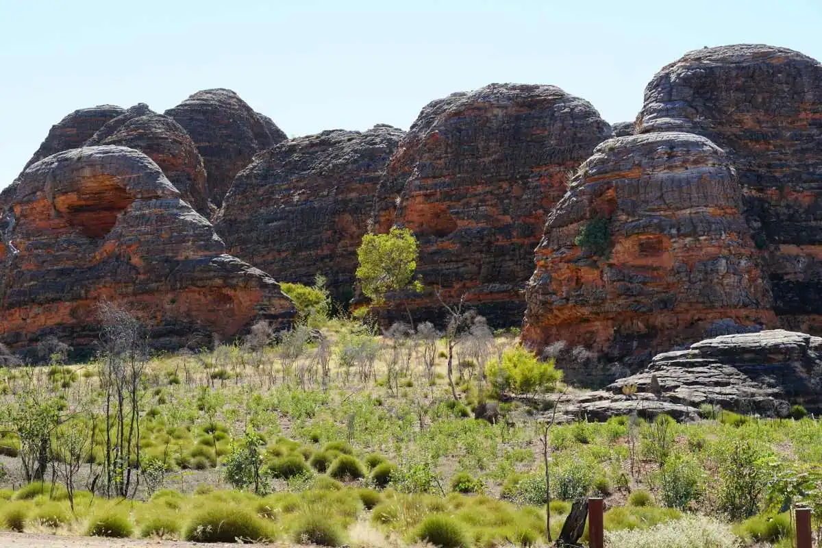 Large dome shaped rocked with black and orage stripes in the Australian outback