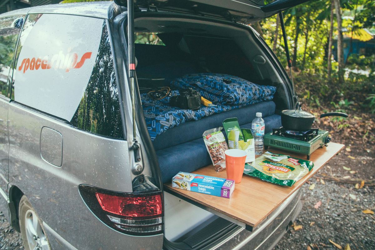 Photo of the back of the Alpha campervan with the cooking area set up